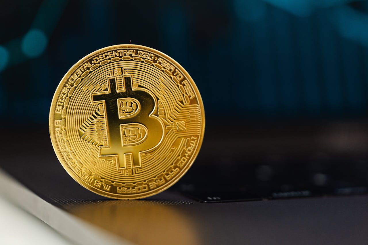 gold bitcoin against dark background